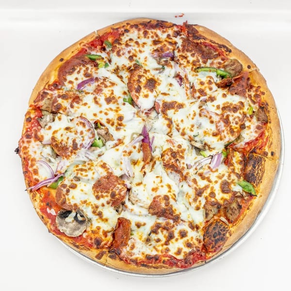 Mangiamo La Pizza's supreme pizza, topped with pepperoni, sausage, mushrooms, onions, and peppers.