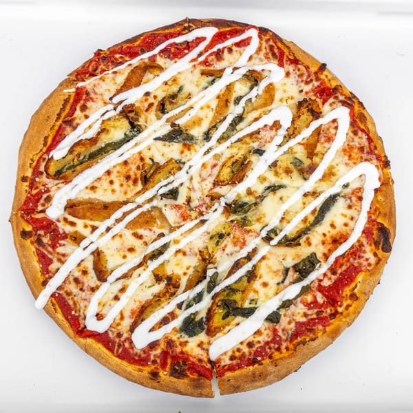 Mangiamo La Pizza's whole pizza with tomato sauce, melted cheese, and white sauce drizzled on top.